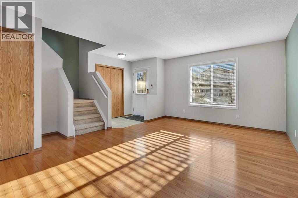 Hardwood Floors - 183 Covepark Way Ne, Calgary, AB - Indoor Photo Showing Other Room