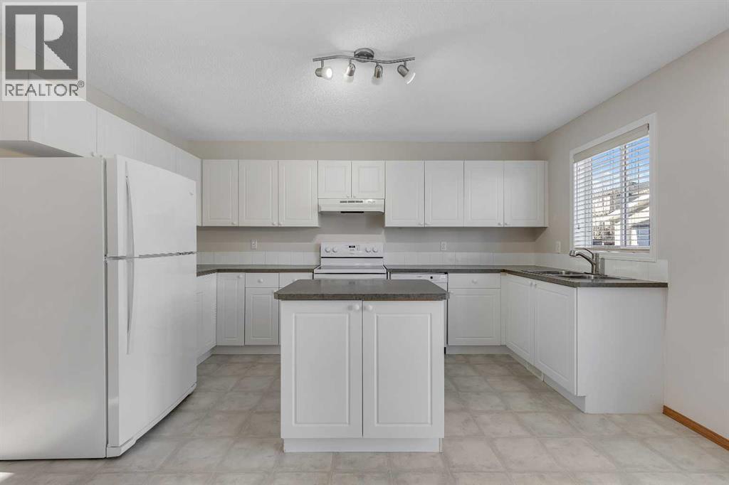 Lots of Counter/Cabinet Space - 183 Covepark Way Ne, Calgary, AB - Indoor Photo Showing Kitchen With Double Sink