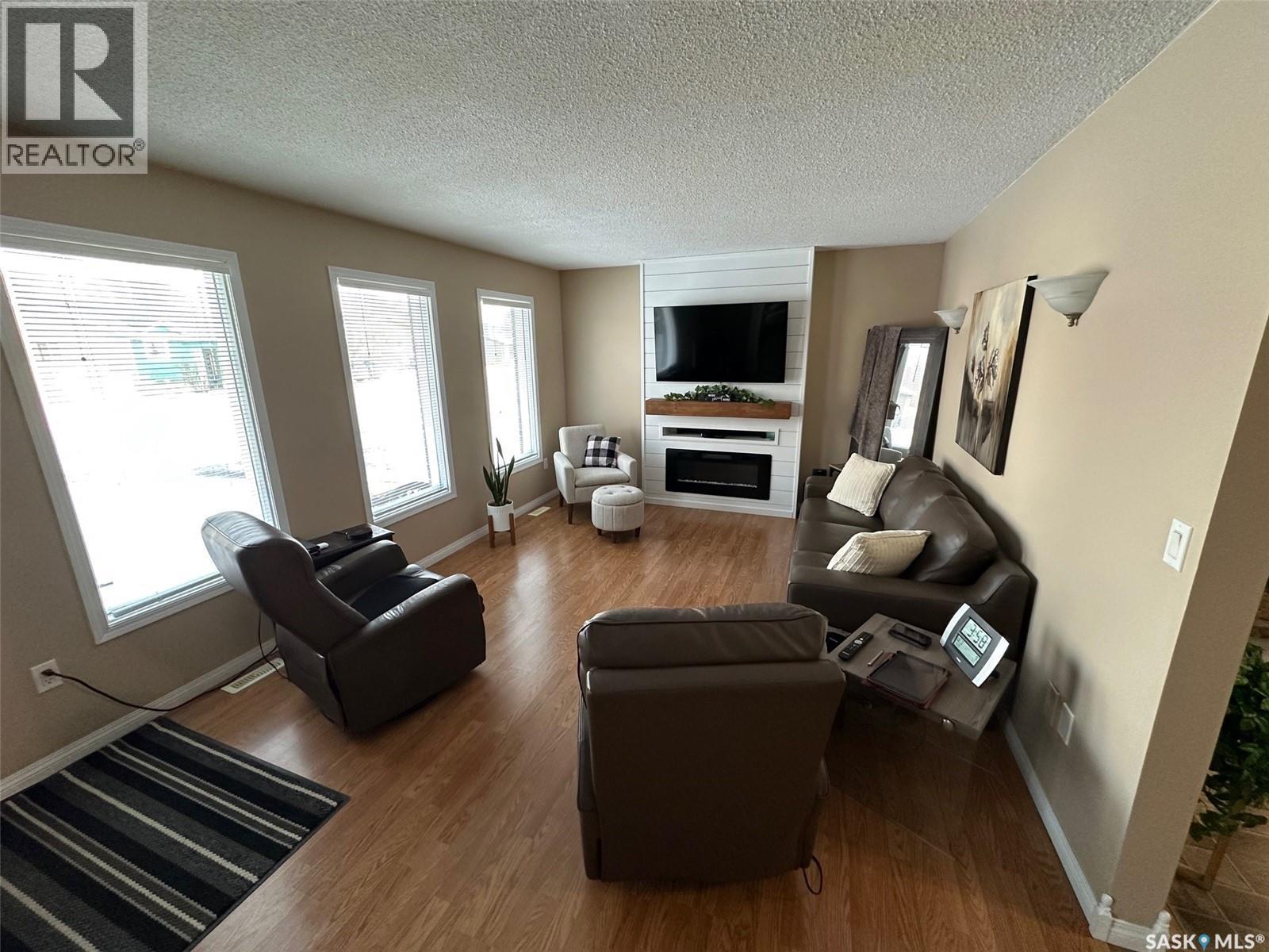 1483 Mather Crescent, Estevan, SK - Indoor Photo Showing Living Room With Fireplace