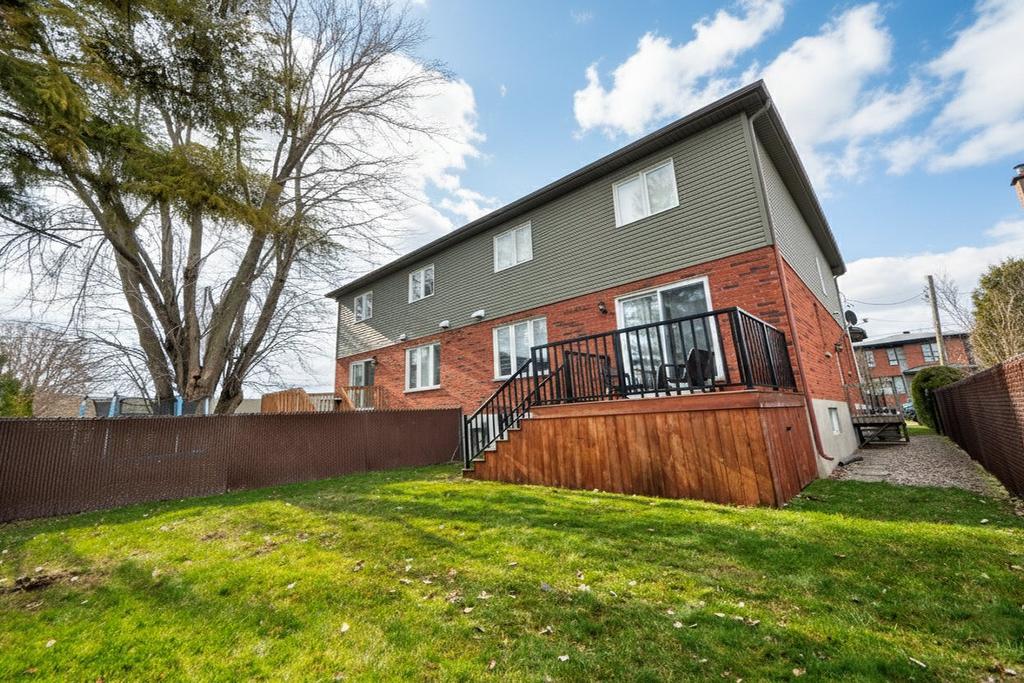 Back facade - 5527 Rue Aline, Brossard, QC - Outdoor With Deck Patio Veranda