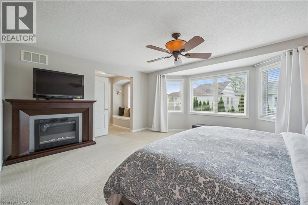 Primary Bedroom with electric fireplace - 79 Zieman Crescent, Cambridge, ON - Indoor Photo Showing Bedroom