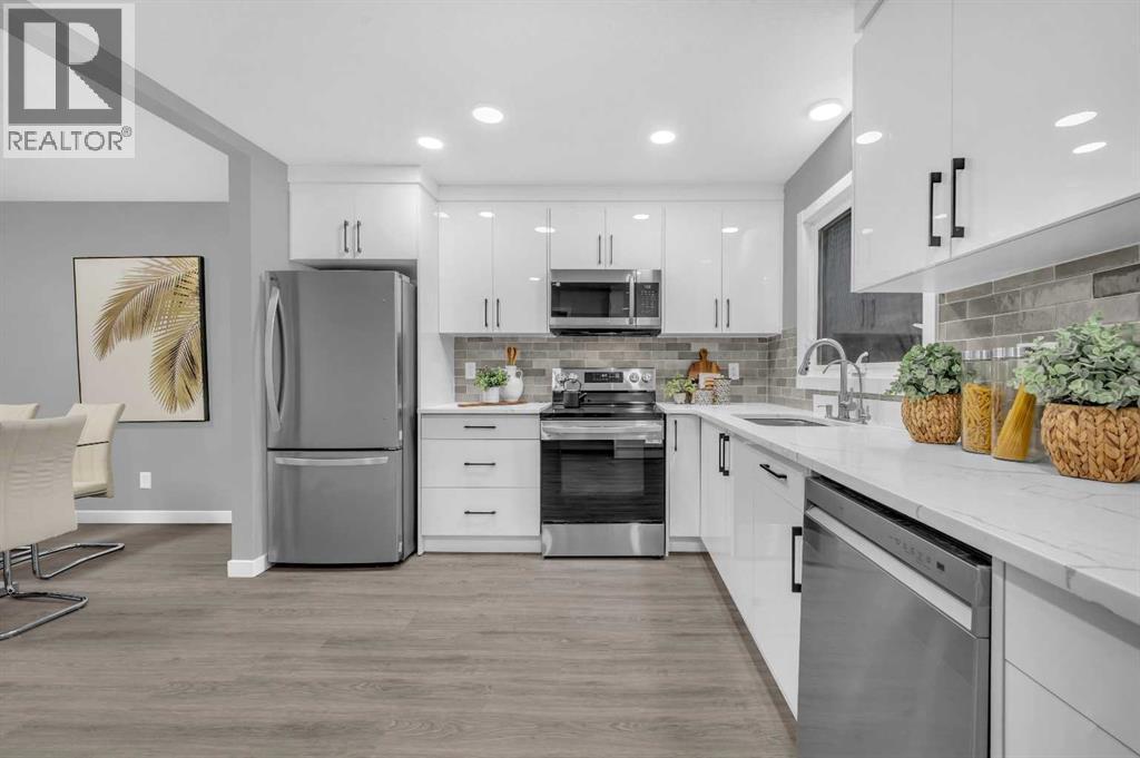 5868 Dalcastle Drive Nw, Calgary, AB - Indoor Photo Showing Kitchen With Upgraded Kitchen