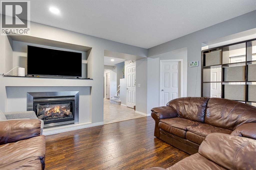 36 Bridlecrest Street Sw, Calgary, AB - Indoor Photo Showing Living Room With Fireplace