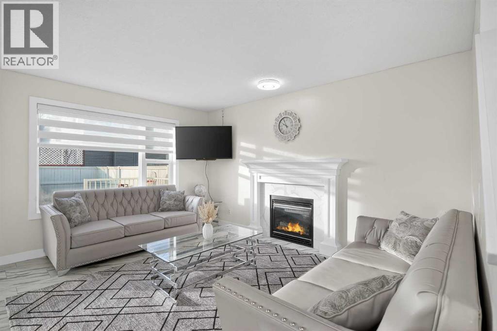 143 Taralake Way Ne, Calgary, AB - Indoor Photo Showing Living Room With Fireplace