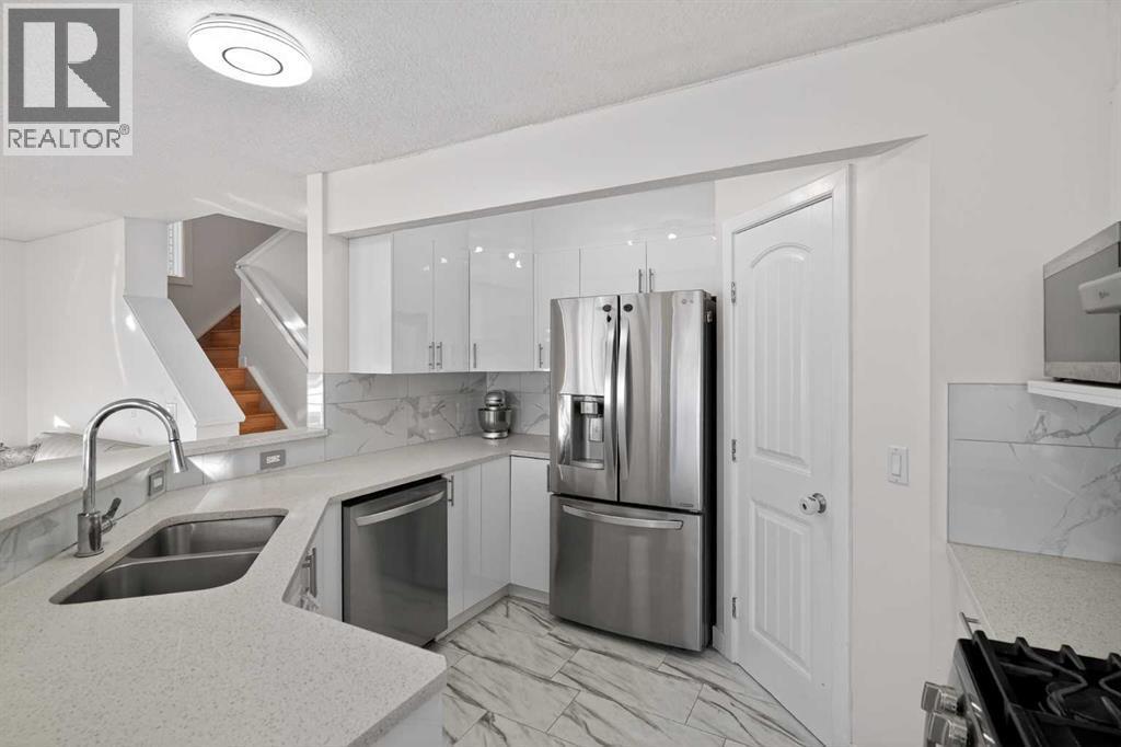 143 Taralake Way Ne, Calgary, AB - Indoor Photo Showing Kitchen With Double Sink
