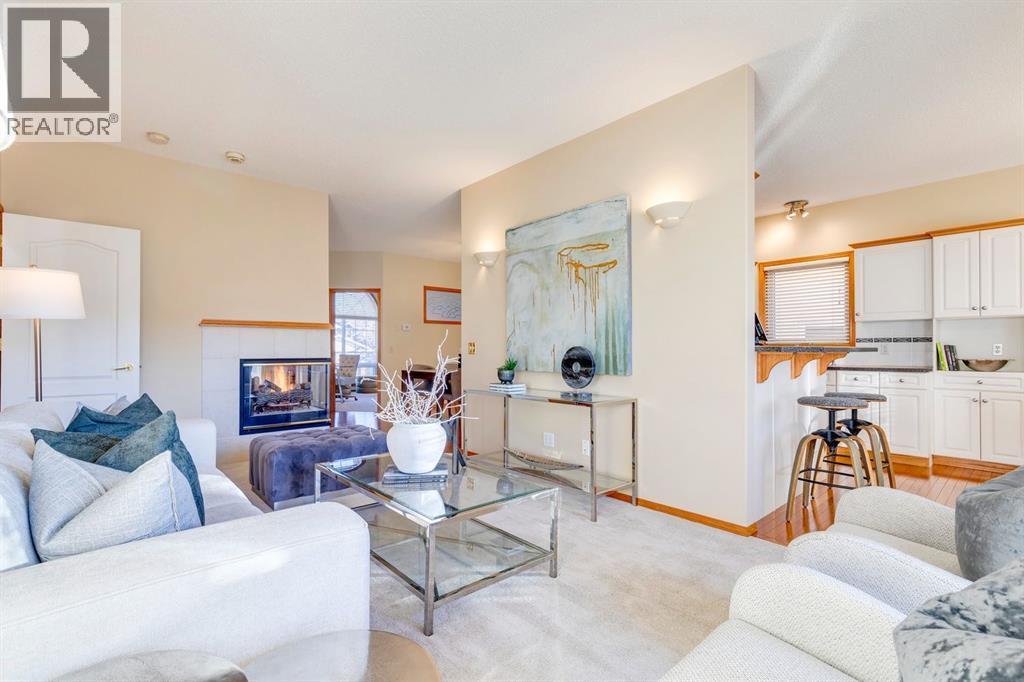 15875 Shannon Link Sw, Calgary, AB - Indoor Photo Showing Living Room With Fireplace