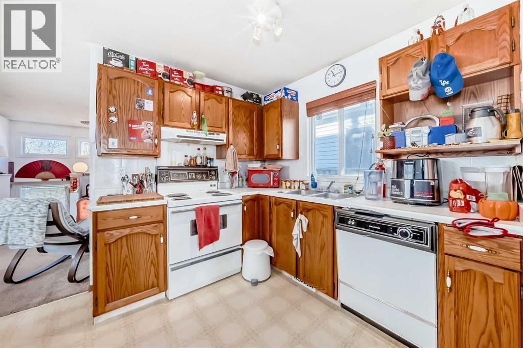 142 Hunterhorn Drive Ne, Calgary, AB - Indoor Photo Showing Kitchen With Double Sink