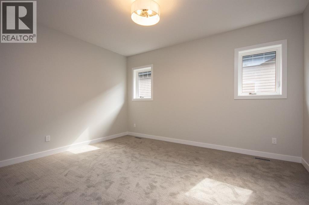 Photos and renderings are examples from a similar home built previously and do not necessarily reflect finished and colours used in this home - 37 Terra Close, Red Deer, AB - Indoor Photo Showing Other Room