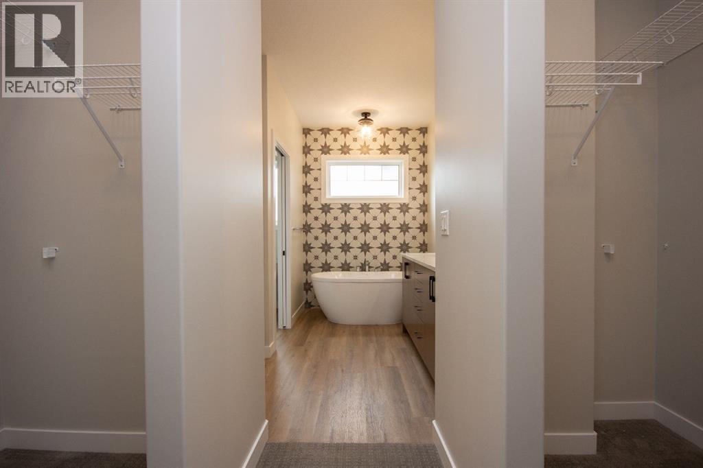Photos and renderings are examples from a similar home built previously and do not necessarily reflect finished and colours used in this home - 37 Terra Close, Red Deer, AB - Indoor Photo Showing Bathroom