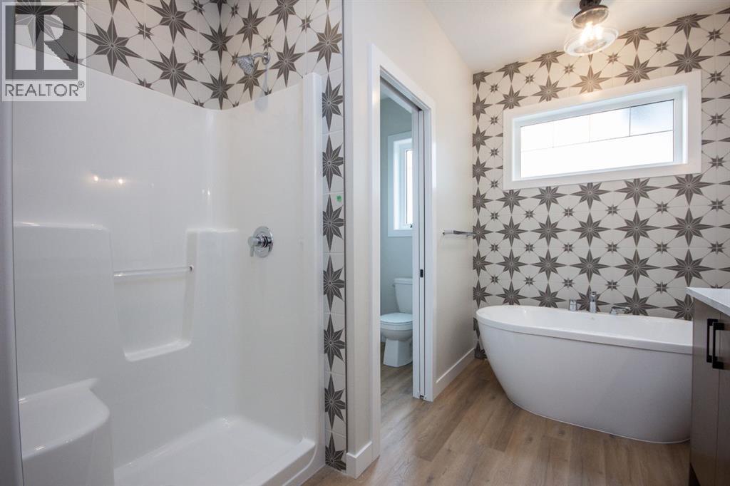 Photos and renderings are examples from a similar home built previously and do not necessarily reflect finished and colours used in this home - 37 Terra Close, Red Deer, AB - Indoor Photo Showing Bathroom