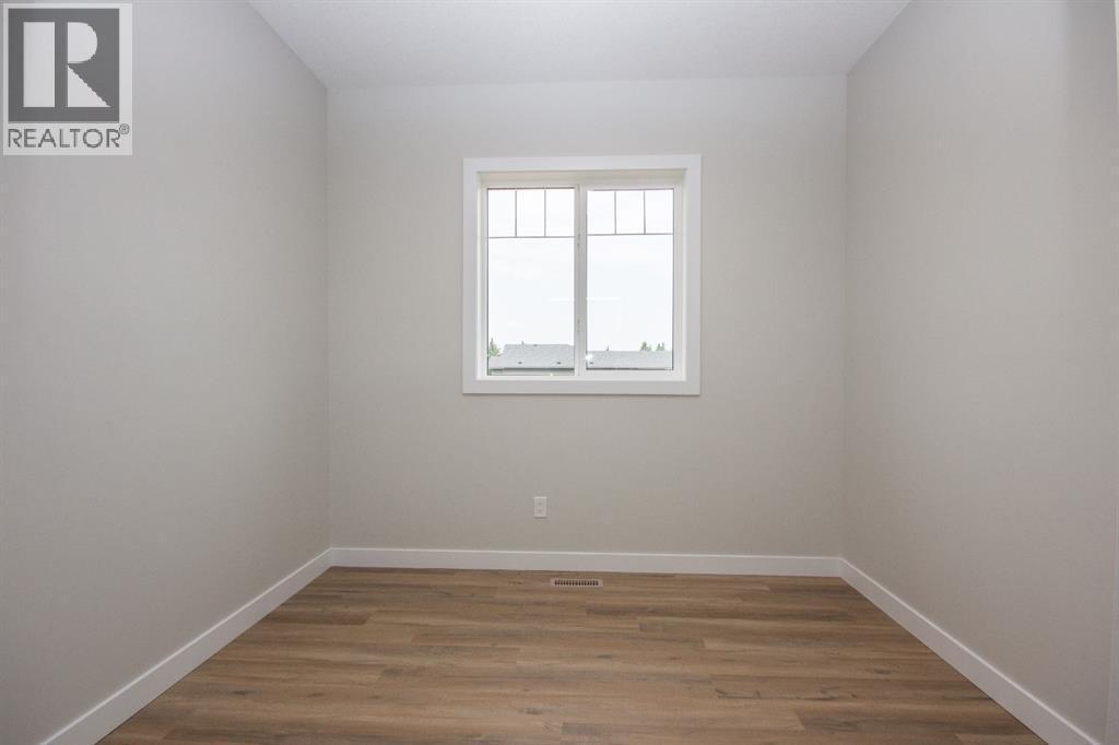 Photos and renderings are examples from a similar home built previously and do not necessarily reflect finished and colours used in this home - 37 Terra Close, Red Deer, AB - Indoor Photo Showing Other Room