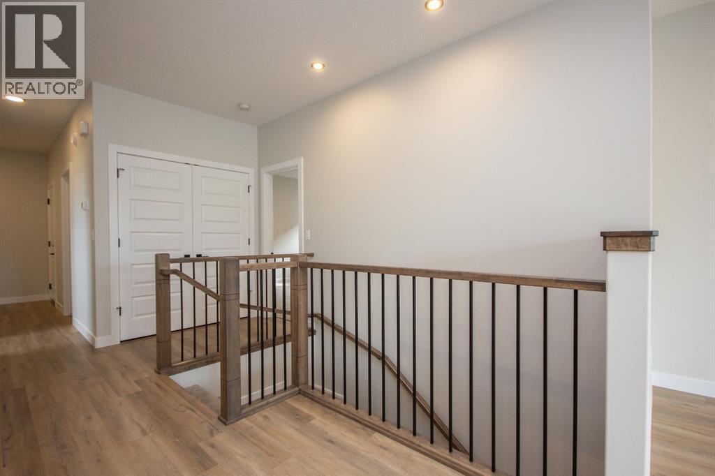 Photos and renderings are examples from a similar home built previously and do not necessarily reflect finished and colours used in this home - 37 Terra Close, Red Deer, AB - Indoor Photo Showing Other Room