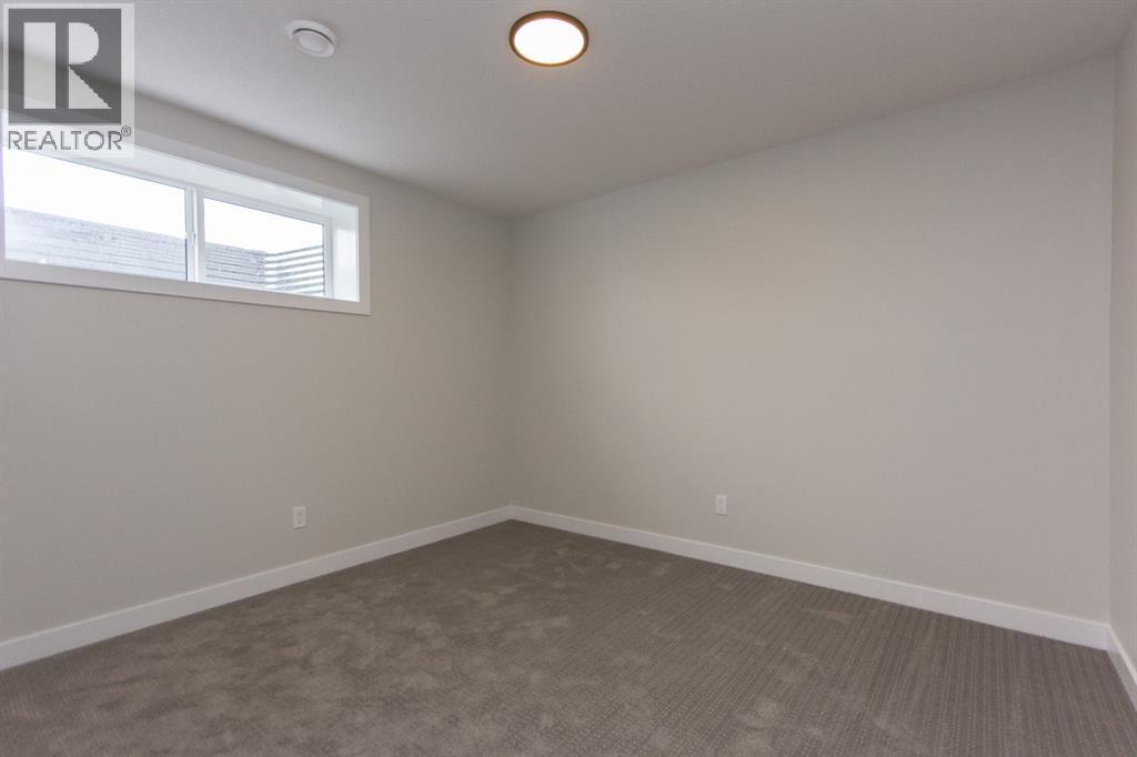 Photos and renderings are examples from a similar home built previously and do not necessarily reflect finished and colours used in this home - 37 Terra Close, Red Deer, AB - Indoor Photo Showing Other Room