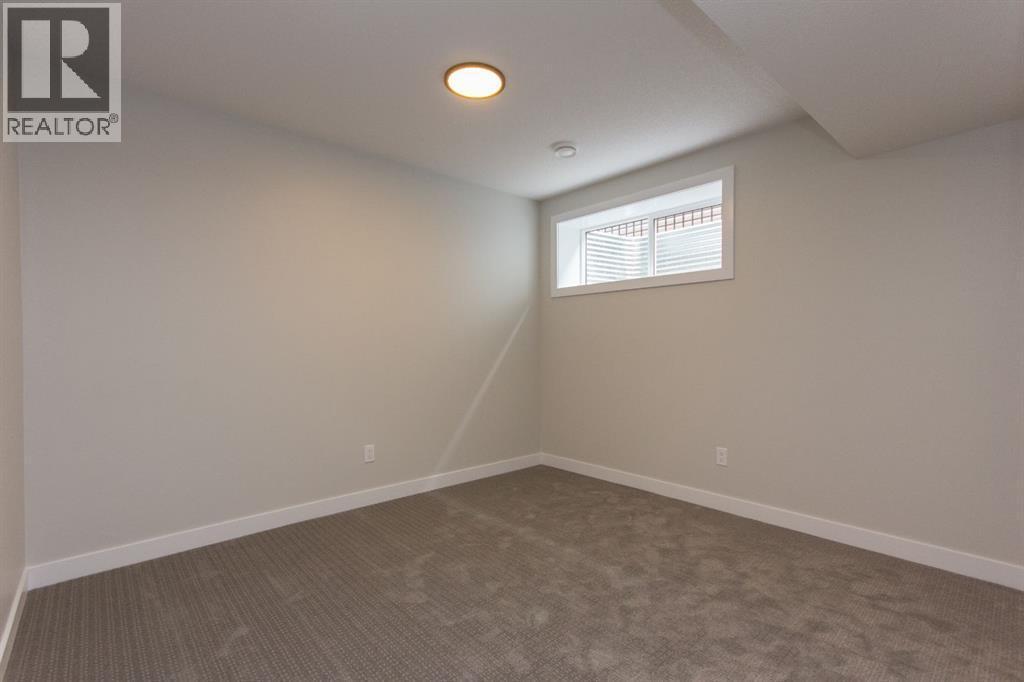 Photos and renderings are examples from a similar home built previously and do not necessarily reflect finished and colours used in this home - 37 Terra Close, Red Deer, AB - Indoor Photo Showing Other Room