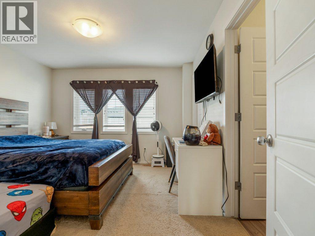 702, 210 Firelight Way W, Lethbridge, AB - Indoor Photo Showing Bedroom