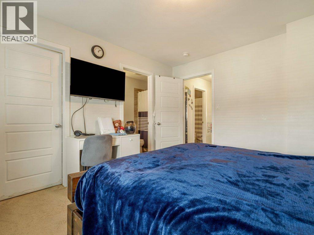 702, 210 Firelight Way W, Lethbridge, AB - Indoor Photo Showing Bedroom