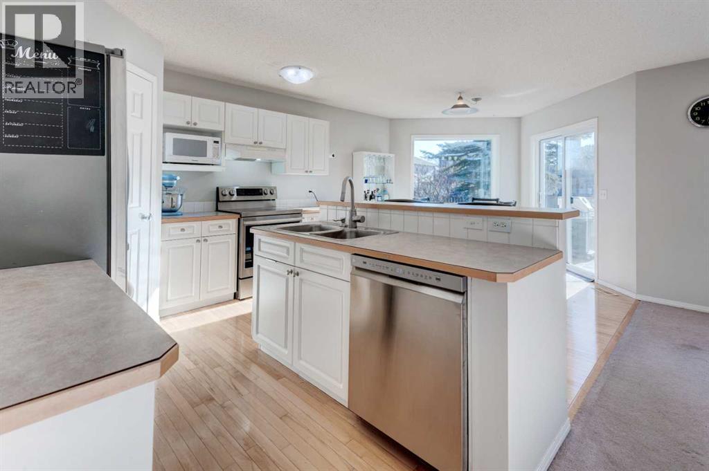 239 Chapalina Place Se, Calgary, AB - Indoor Photo Showing Kitchen With Double Sink