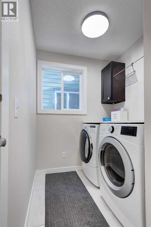 239 Chapalina Place Se, Calgary, AB - Indoor Photo Showing Laundry Room