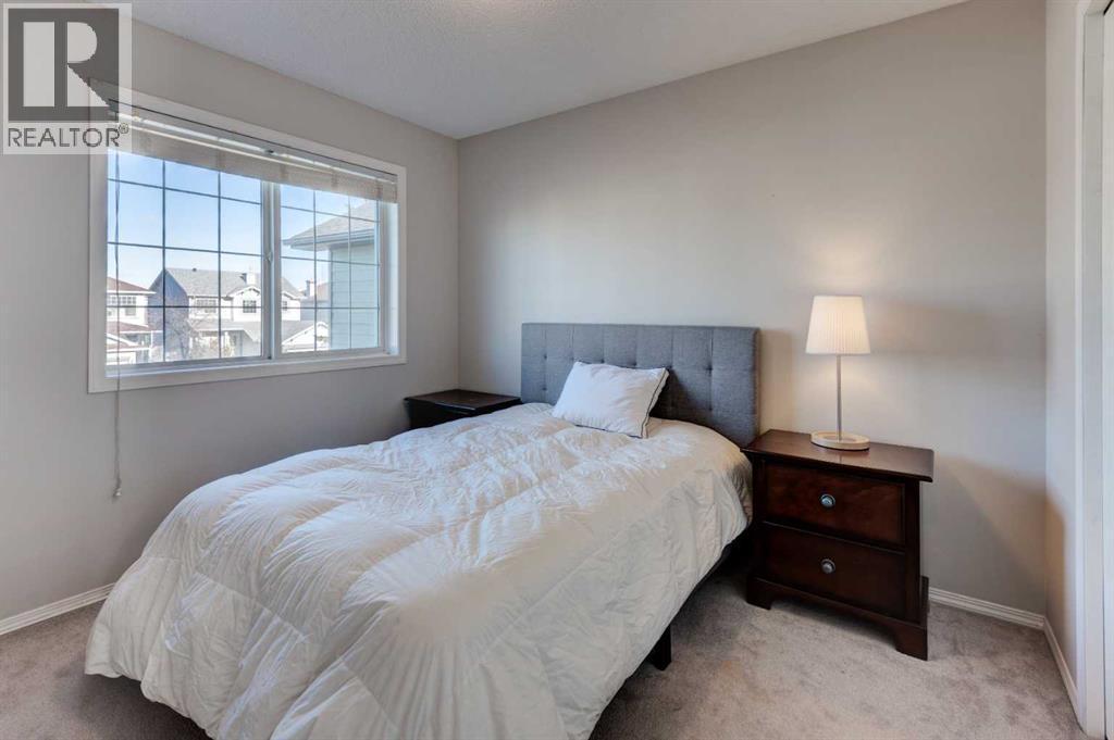 239 Chapalina Place Se, Calgary, AB - Indoor Photo Showing Bedroom