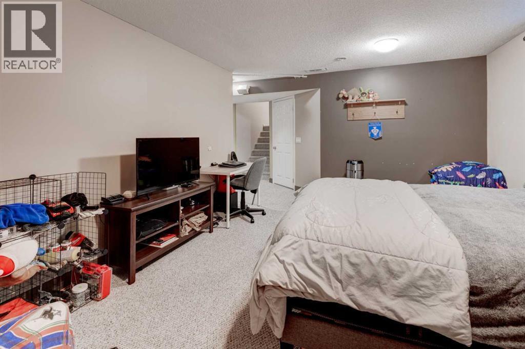 239 Chapalina Place Se, Calgary, AB - Indoor Photo Showing Bedroom