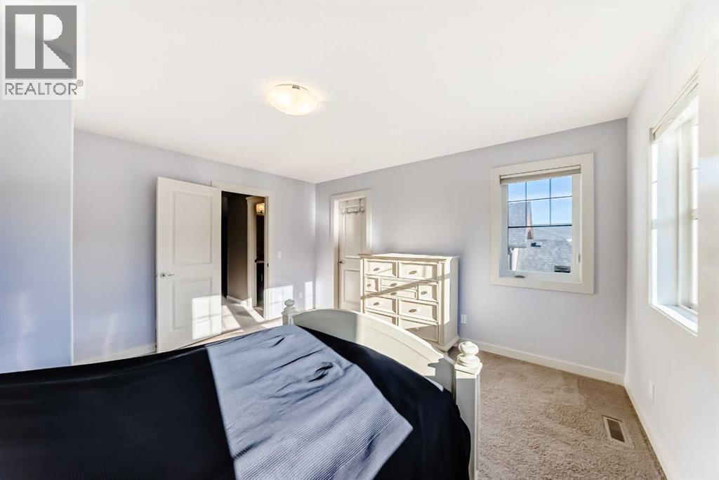 49 Crestridge View Sw, Calgary, AB - Indoor Photo Showing Bedroom