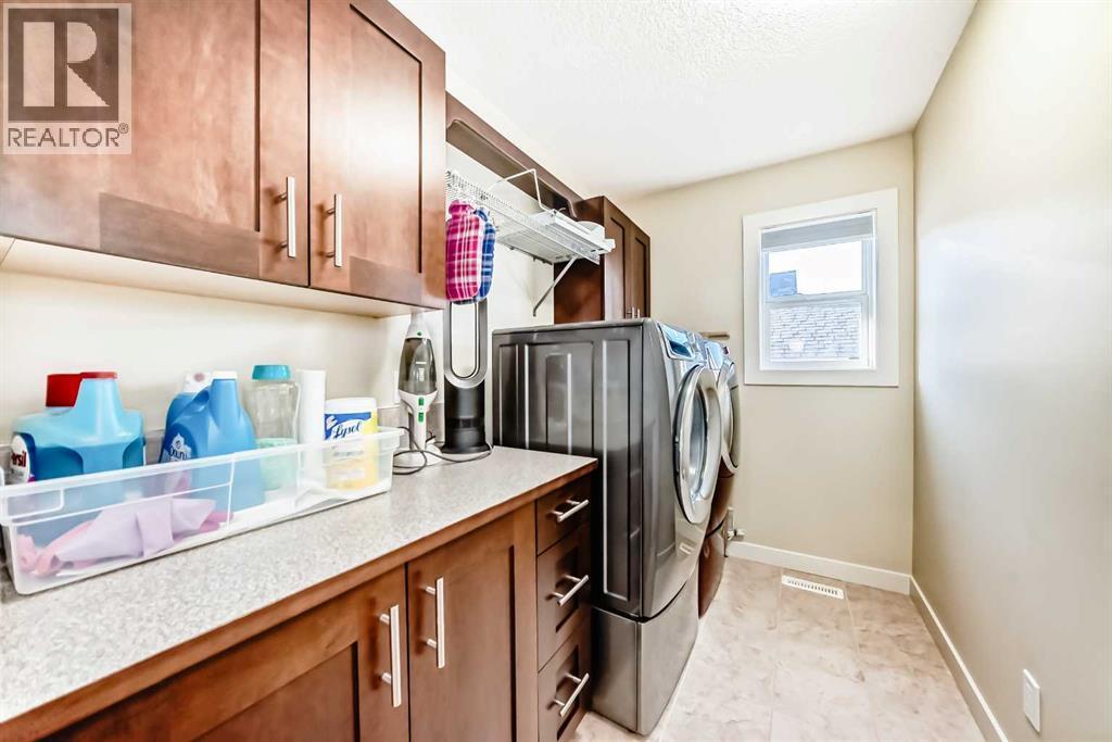 49 Crestridge View Sw, Calgary, AB - Indoor Photo Showing Laundry Room