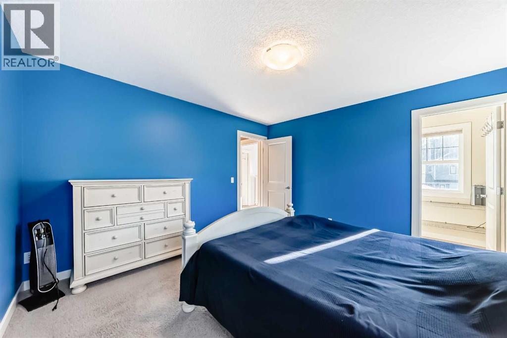 49 Crestridge View Sw, Calgary, AB - Indoor Photo Showing Bedroom