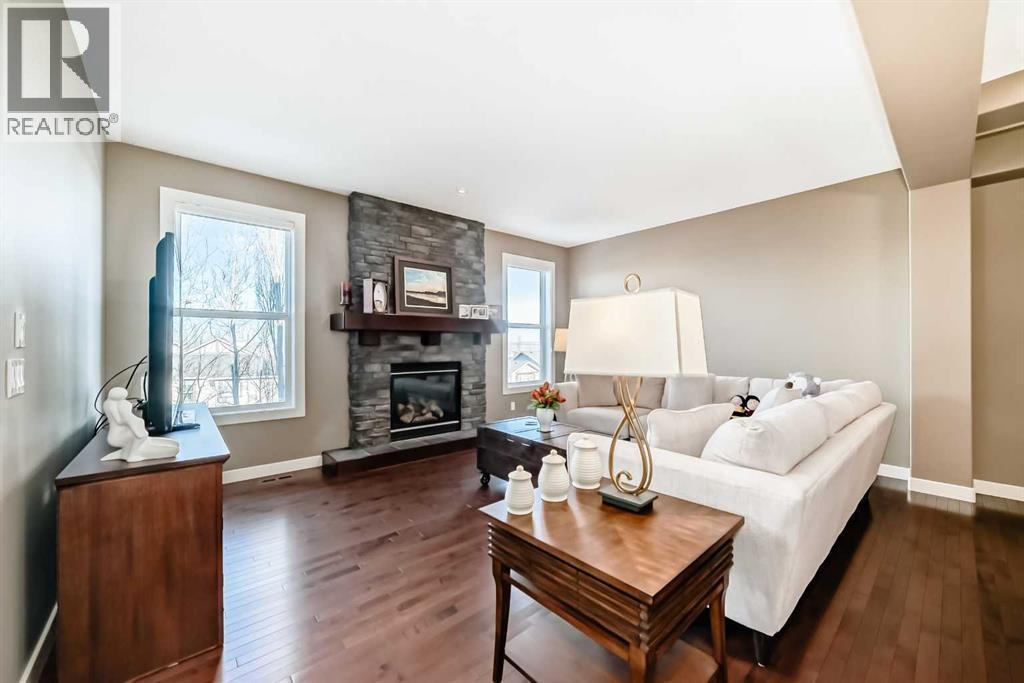 49 Crestridge View Sw, Calgary, AB - Indoor Photo Showing Living Room With Fireplace