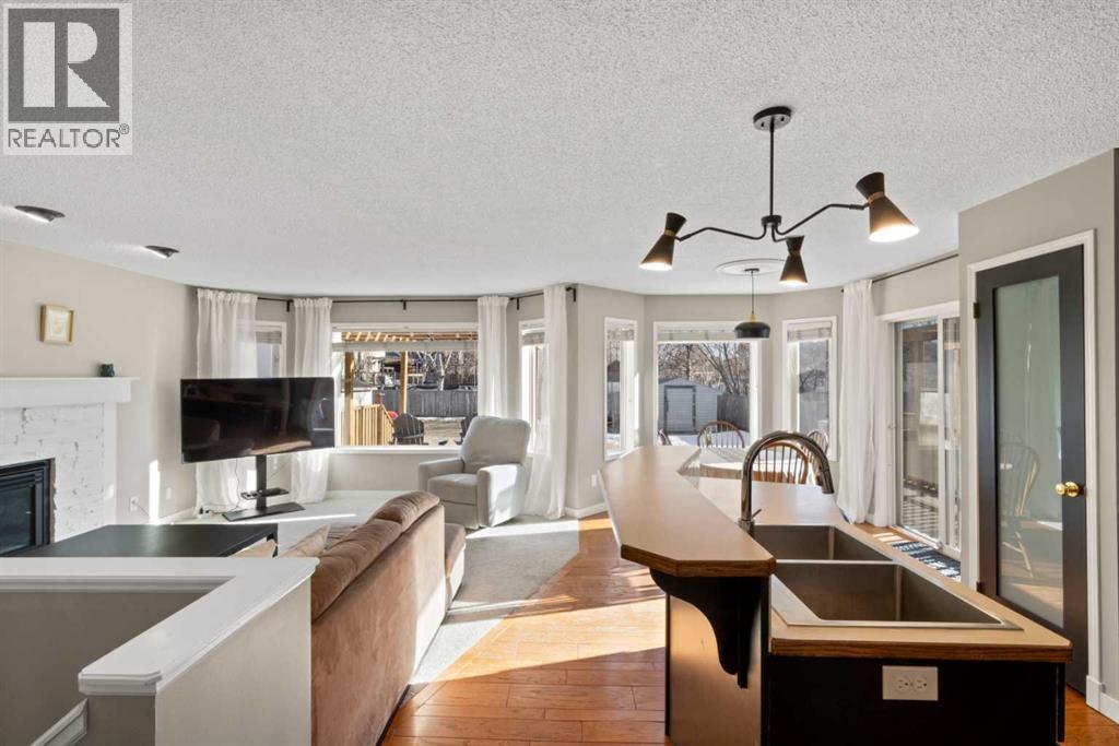 21 Wilson Road Ne, Langdon, AB - Indoor With Fireplace