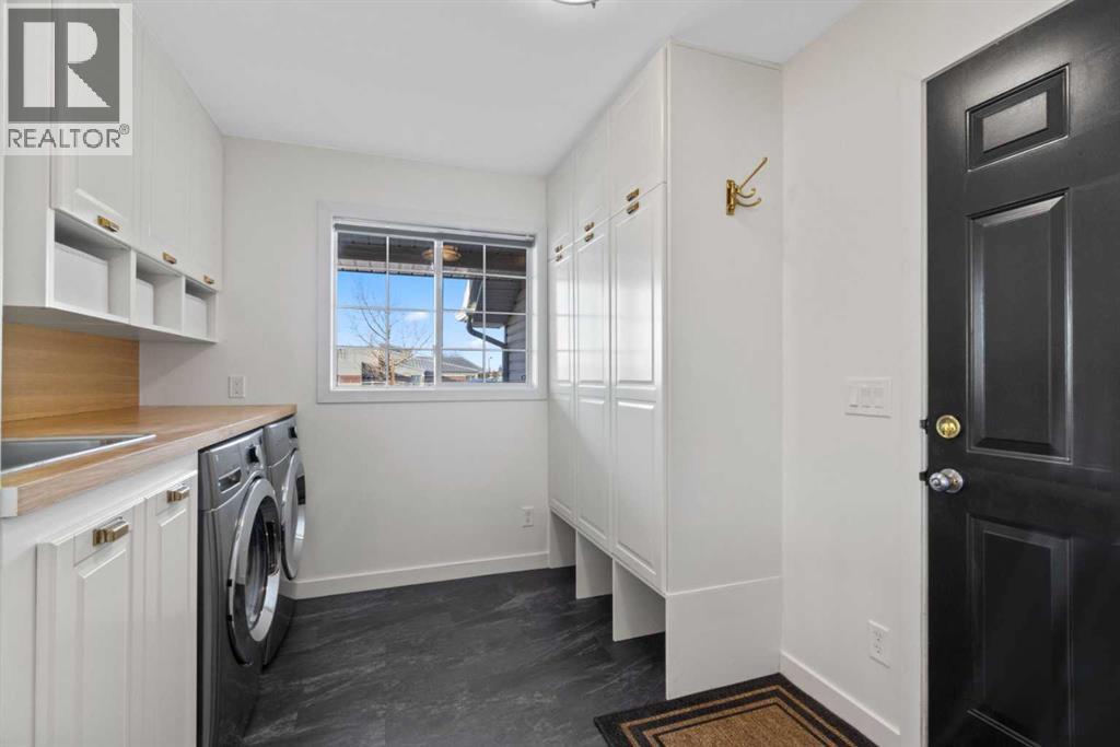 21 Wilson Road Ne, Langdon, AB - Indoor Photo Showing Laundry Room