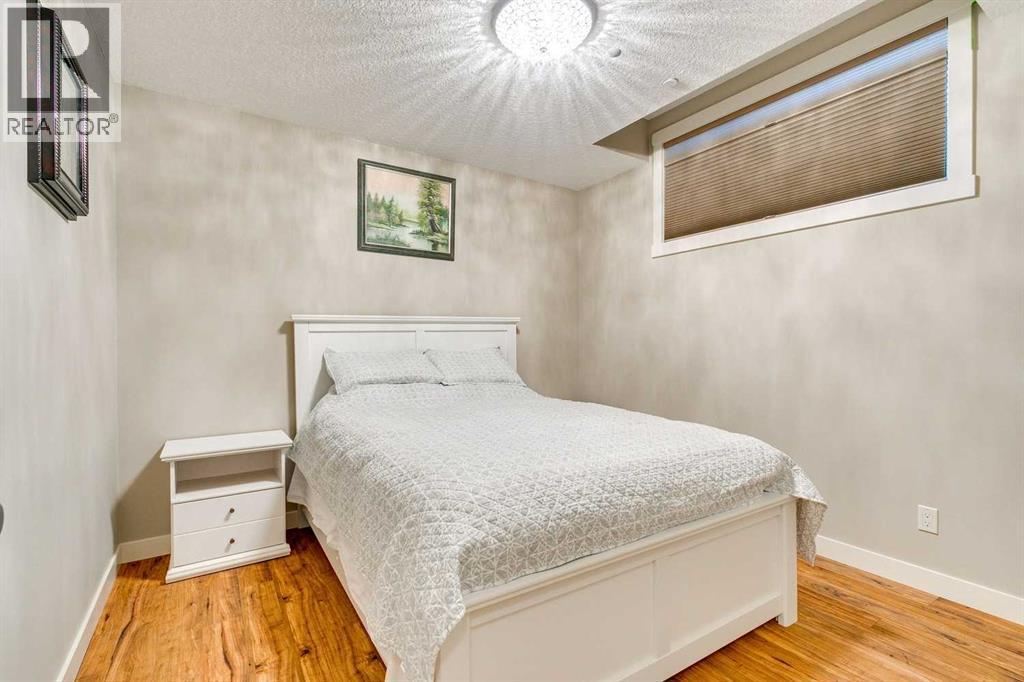 215 Patton Court Sw, Calgary, AB - Indoor Photo Showing Bedroom