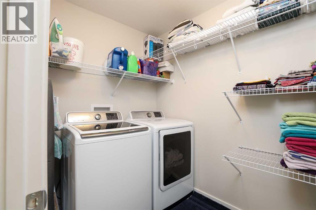 711 Moonlight Crescent W, Lethbridge, AB - Indoor Photo Showing Laundry Room