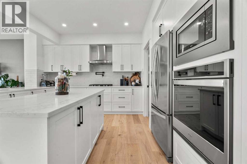 116 Ranchers View, Okotoks, AB - Indoor Photo Showing Kitchen With Upgraded Kitchen