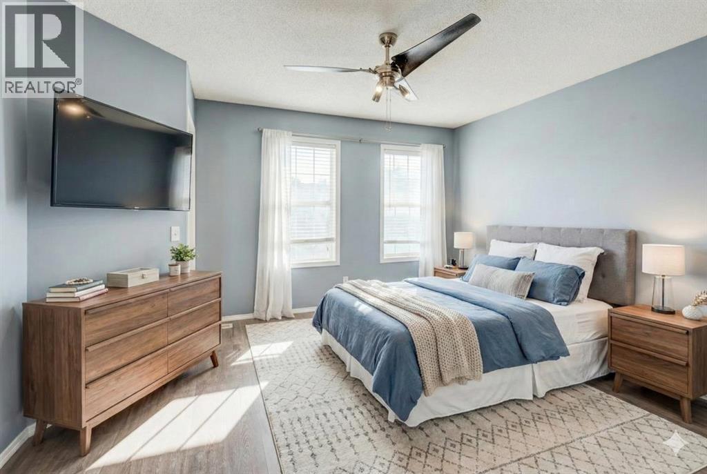 Virtually staged primary bedroom - 16 Elgin Bay Se, Calgary, AB - Indoor Photo Showing Bedroom