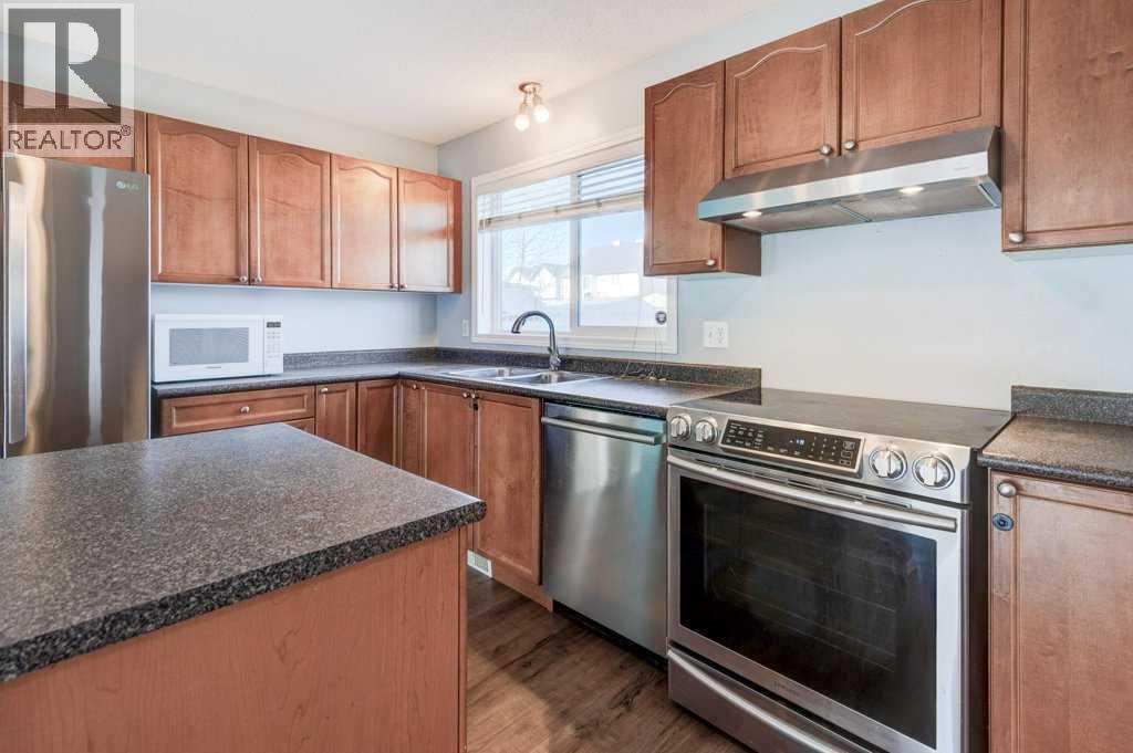 16 Elgin Bay Se, Calgary, AB - Indoor Photo Showing Kitchen With Stainless Steel Kitchen With Double Sink