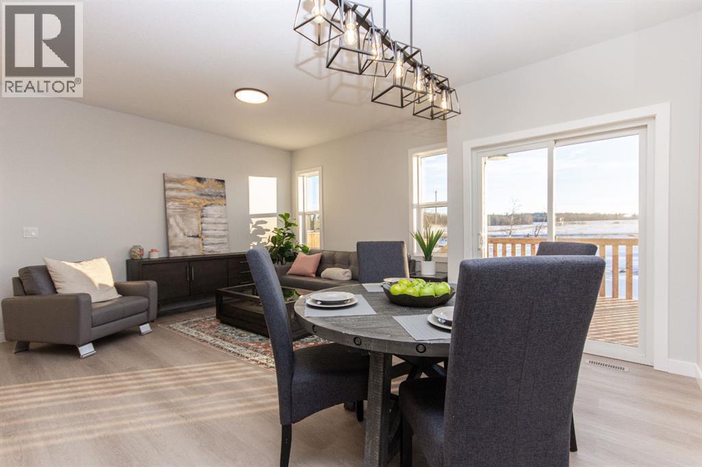 Photos and renderings are examples from a similar home built previously and do not necessarily reflect finished and colours used in this home - 41 Terra Close, Red Deer, AB - Indoor Photo Showing Dining Room