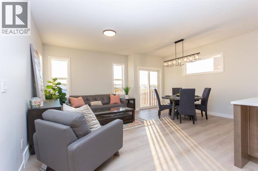 Photos and renderings are examples from a similar home built previously and do not necessarily reflect finished and colours used in this home - 41 Terra Close, Red Deer, AB - Indoor Photo Showing Living Room