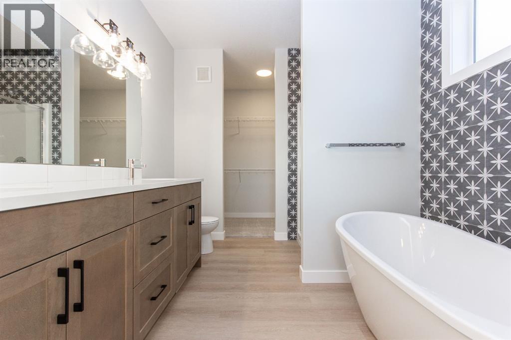 Photos and renderings are examples from a similar home built previously and do not necessarily reflect finished and colours used in this home - 41 Terra Close, Red Deer, AB - Indoor Photo Showing Bathroom