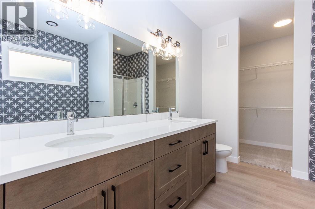 Photos and renderings are examples from a similar home built previously and do not necessarily reflect finished and colours used in this home - 41 Terra Close, Red Deer, AB - Indoor Photo Showing Bathroom