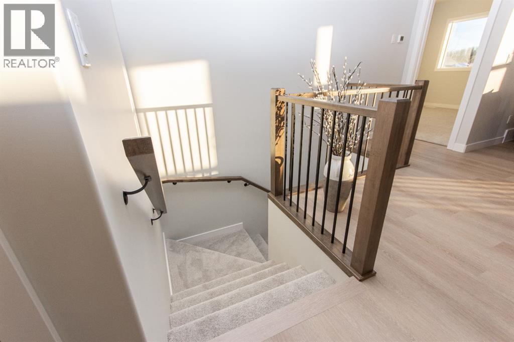 Photos and renderings are examples from a similar home built previously and do not necessarily reflect finished and colours used in this home - 41 Terra Close, Red Deer, AB - Indoor Photo Showing Other Room