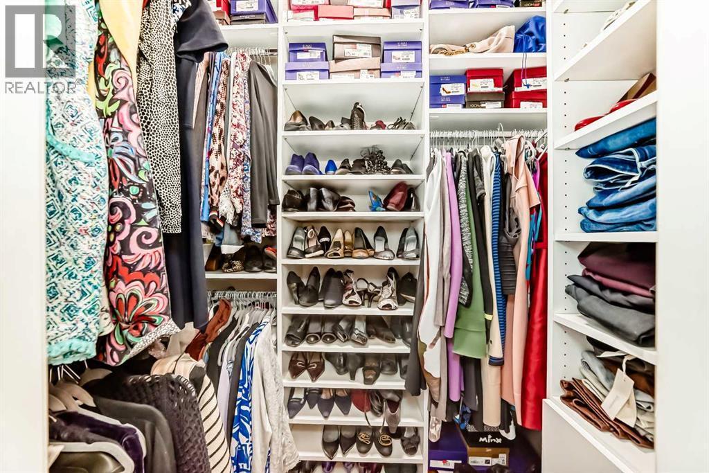 Walk-in closet - 1906 Patterson View Sw, Calgary, AB - Indoor With Storage