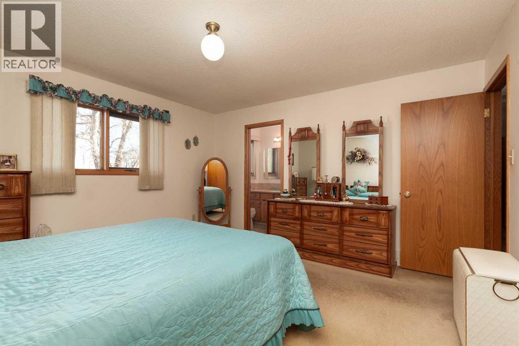 Primary Bedroom - 83 Elm Crescent S, Lethbridge, AB - Indoor Photo Showing Bedroom