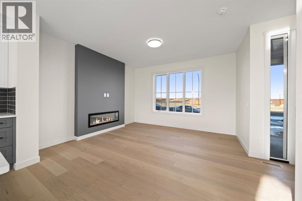 25 Sora Gate Se, Calgary, AB - Indoor Photo Showing Living Room With Fireplace