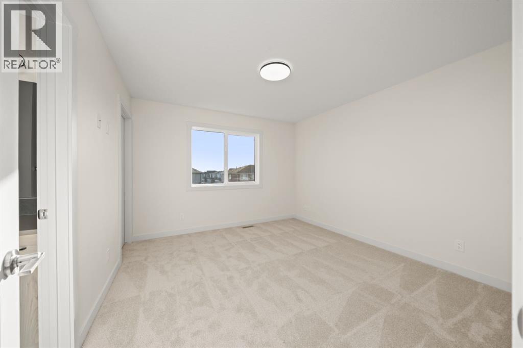 25 Sora Gate Se, Calgary, AB - Indoor Photo Showing Other Room