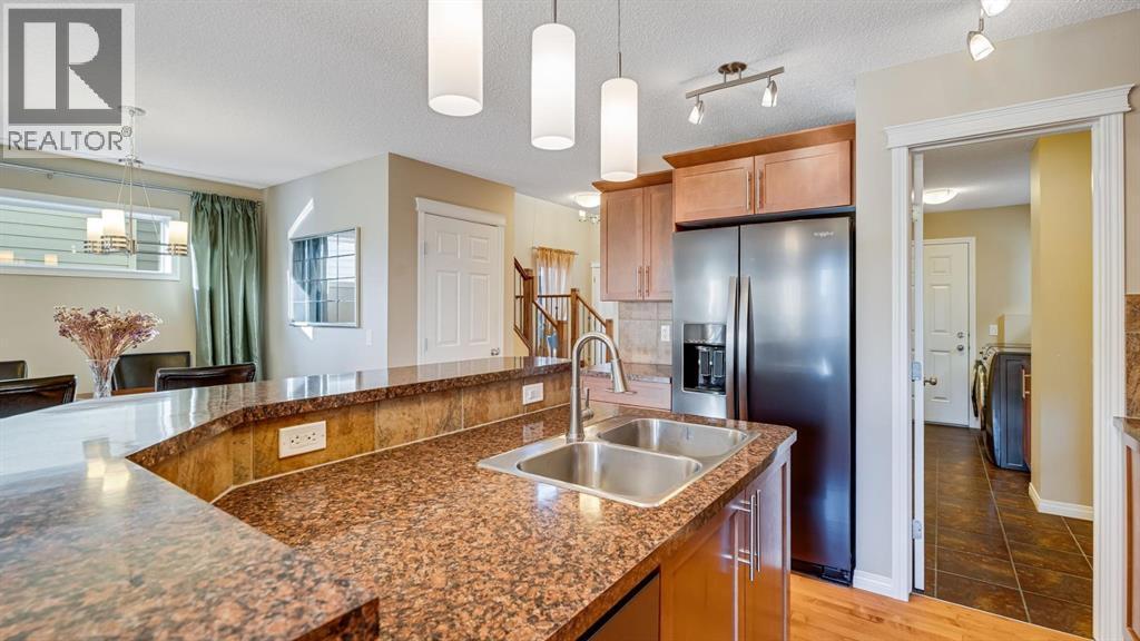 157 Bridleridge View Sw, Calgary, AB - Indoor Photo Showing Kitchen With Double Sink