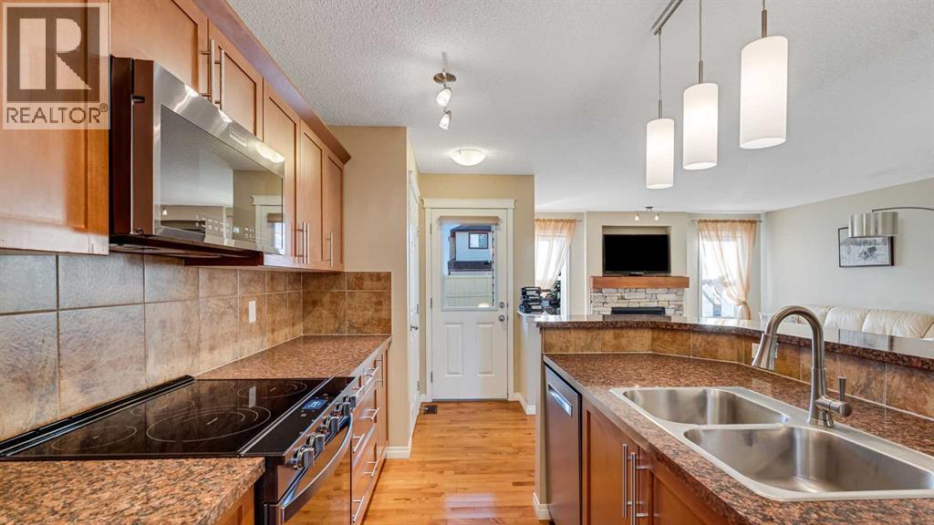 157 Bridleridge View Sw, Calgary, AB - Indoor Photo Showing Kitchen With Double Sink