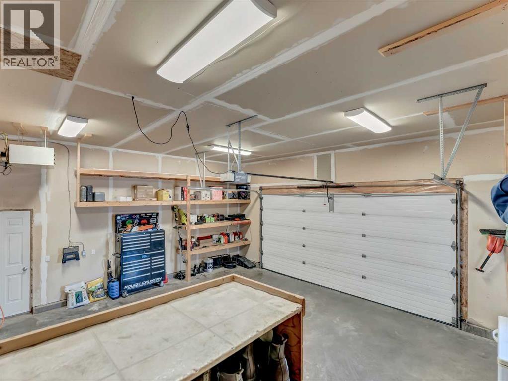 122 Redcliff Way Sw, Redcliff, AB - Indoor Photo Showing Garage