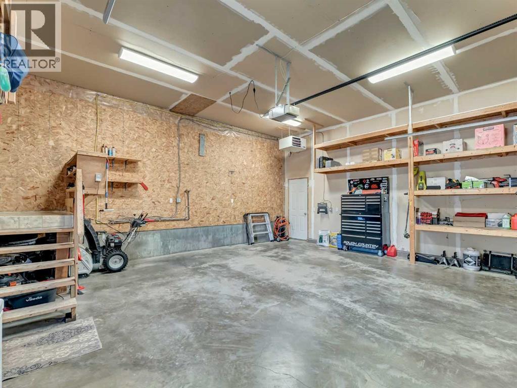 122 Redcliff Way Sw, Redcliff, AB - Indoor Photo Showing Garage