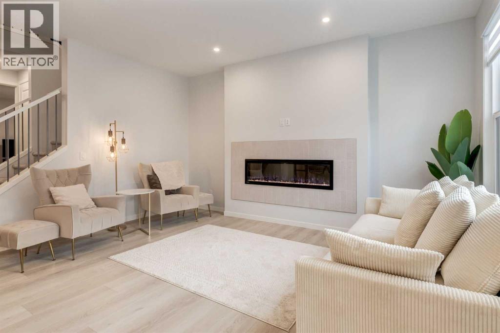 29 Marmot Passage Nw, Calgary, AB - Indoor Photo Showing Living Room With Fireplace