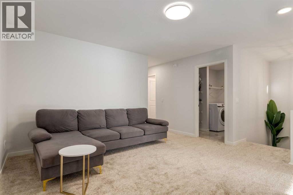 29 Marmot Passage Nw, Calgary, AB - Indoor Photo Showing Living Room